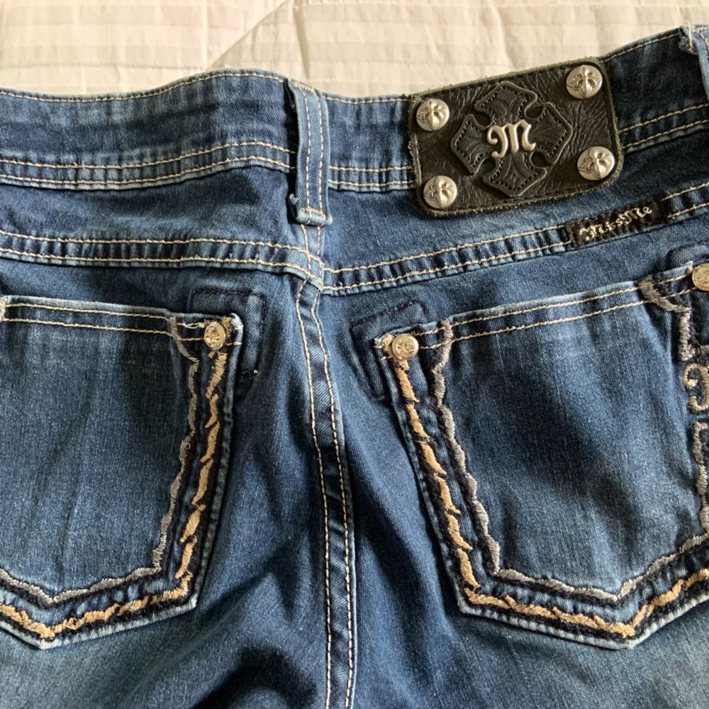 Miss Me skinny jeans~ size 27, faded blue, stitching on back pockets.